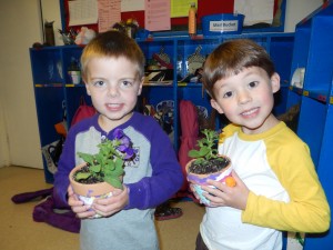 Abe and Luke with their purple petunias. Cotton swabs make great paint brushes.